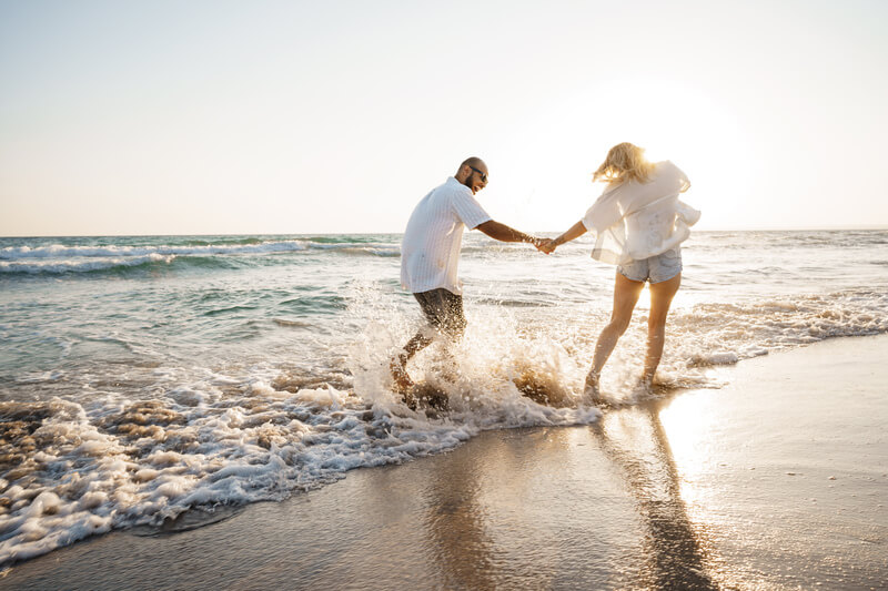 young beautiful couple walking on beach near sea 2022 01 18 23 34 05 utc 2
